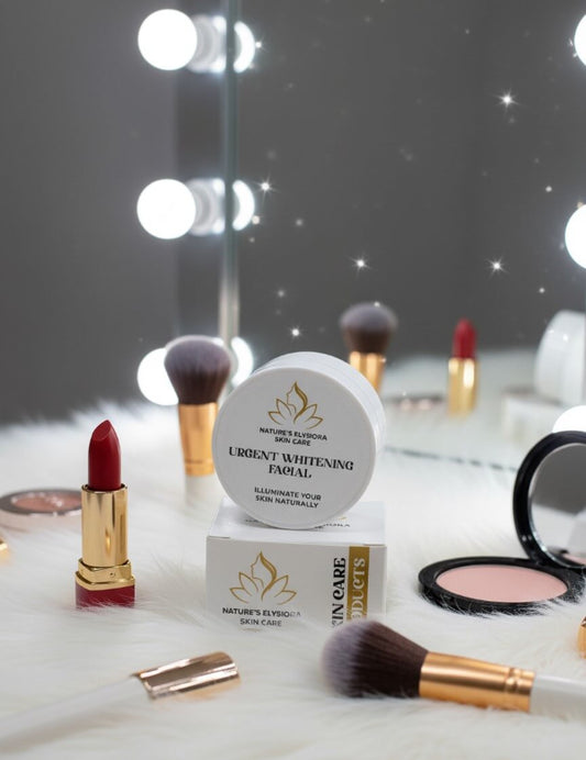 Cosmetic products including a lipstick, facial cream, and makeup brushes on a reflective surface with blurred lights in the background.