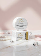 Nature's Elyora skin care product on a marble surface with decorative elements.