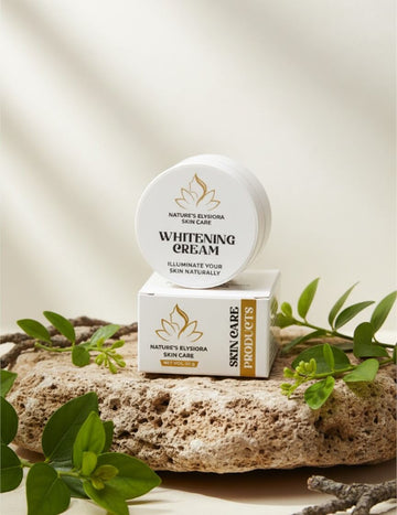 Nature's Elvishara Skin Care Whitening Cream packaging on a stone surface with green leaves.