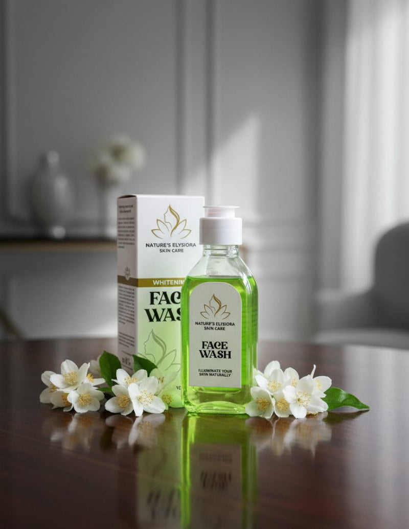 Green face wash bottle with packaging on a wooden surface with white flowers.