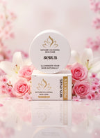 Nature's Elyziora skin care scrub and packaging with pink flowers in the background